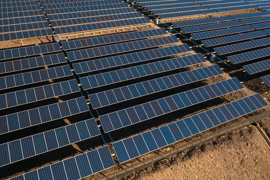 Solar panels against the backdrop of South Africa's landscape.